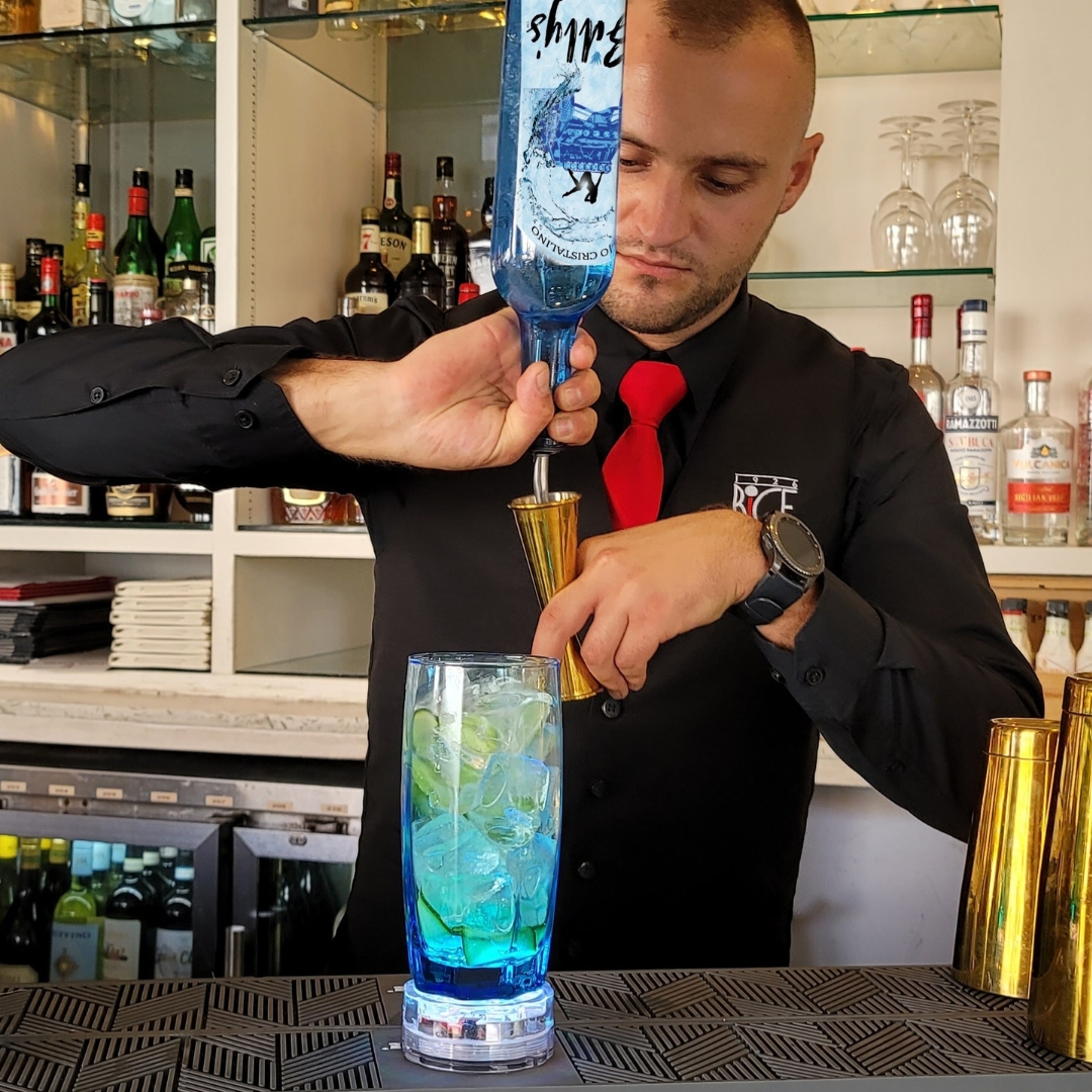 Male Bartender Pouring Drink